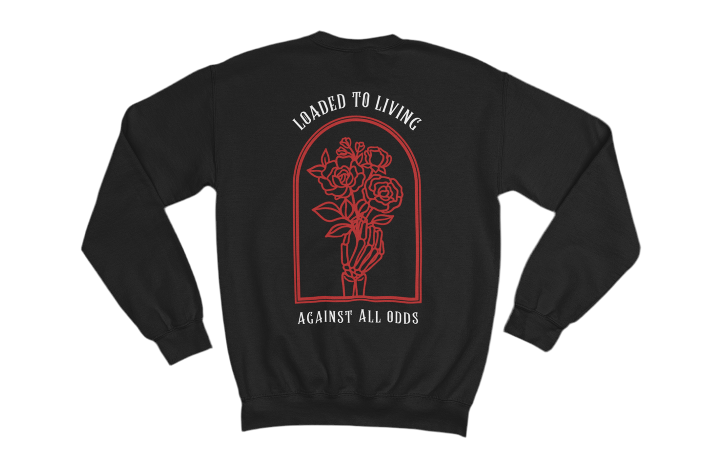 This black sweatshirt features a bold and symbolic design on the back. The central artwork consists of a skeletal hand holding a bouquet of roses, enclosed within an arched frame. Above the image, the phrase “LOADED TO LIVING” is written, while below, it says “AGAINST ALL ODDS.” 