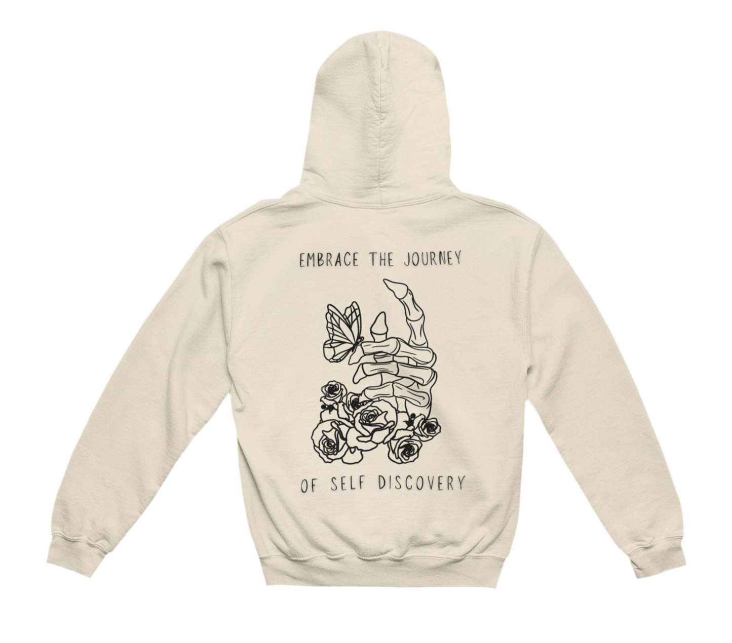 This beige hoodie features a bold black-and-white graphic on the back, centered around a skeletal hand with roses growing around it and a butterfly resting on the fingers. The design is framed by the phrase “EMBRACE THE JOURNEY OF SELF DISCOVERY”