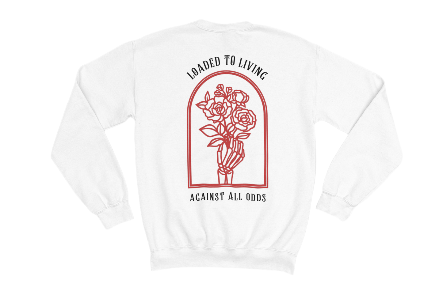 This white sweatshirt features a bold and symbolic design on the back. The central artwork consists of a skeletal hand holding a bouquet of roses, enclosed within an arched frame. Above the image, the phrase “LOADED TO LIVING” is written, while below, it says “AGAINST ALL ODDS.” 