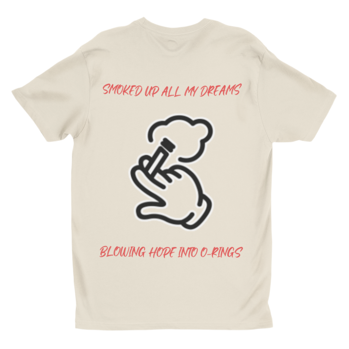 This beige T-shirt in the image has a white outline graphic of a hand holding a smoking object, exhaling a cloud of smoke. The text on the shirt is red and reads: “SMOKED UP ALL MY DREAMS” (at the top)
“BLOWING HOPE INTO O-RINGS” (at the bottom) 